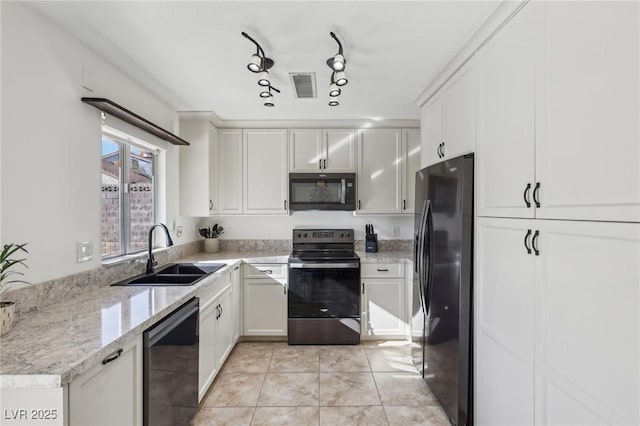 kitchen featuring visible vents, black appliances, white cabinetry, a sink, and light tile patterned flooring