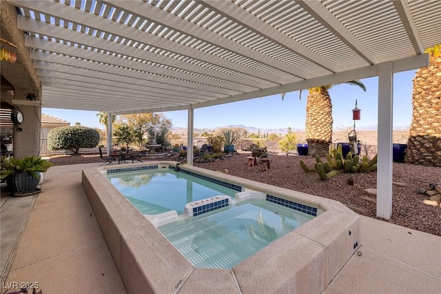 view of swimming pool with a pool with connected hot tub, a mountain view, a patio, and a pergola