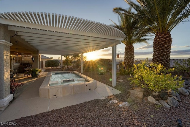 view of swimming pool with an in ground hot tub, a patio, and a pergola