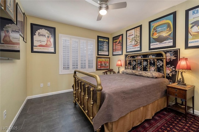 bedroom with ceiling fan and baseboards