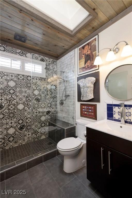 full bath featuring toilet, wooden ceiling, vanity, and tile patterned floors