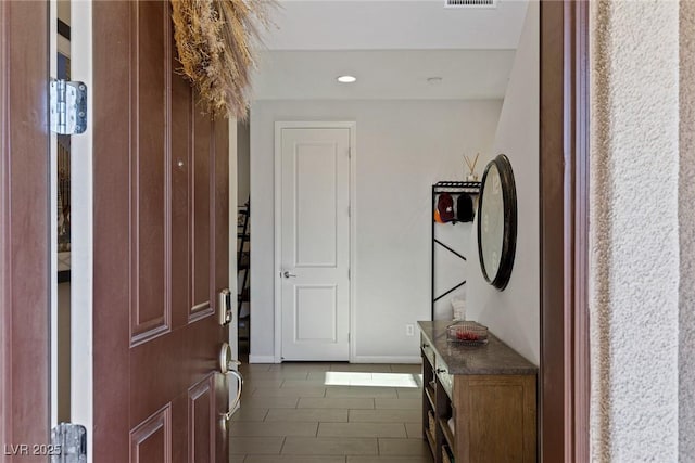 entryway featuring visible vents and baseboards