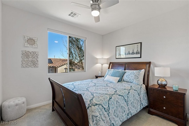 bedroom with light colored carpet, visible vents, ceiling fan, and baseboards