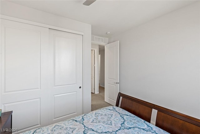 bedroom with carpet, a closet, and visible vents