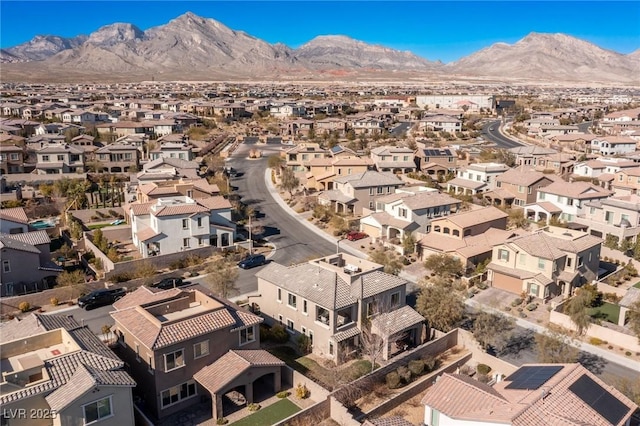 birds eye view of property with a residential view and a mountain view