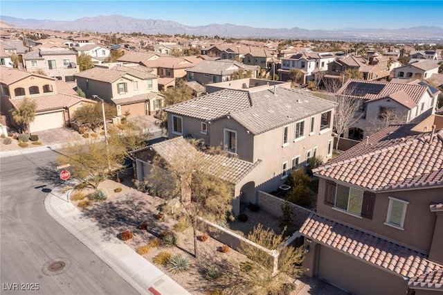 bird's eye view featuring a residential view and a mountain view