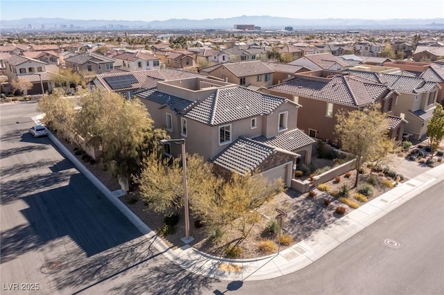 birds eye view of property with a residential view and a mountain view