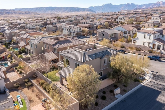 drone / aerial view with a residential view and a mountain view