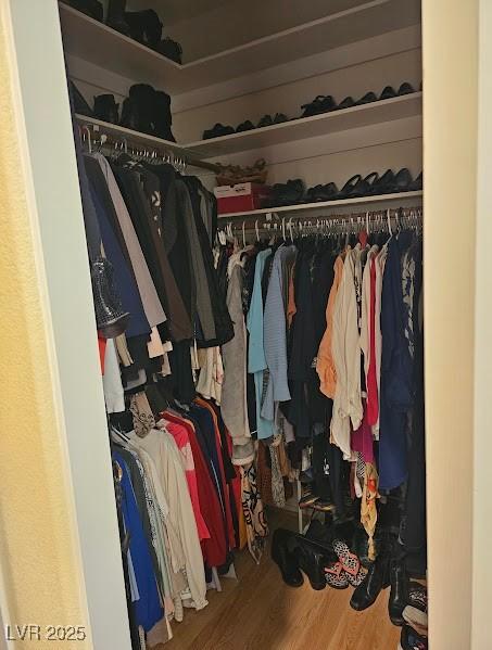 spacious closet featuring wood finished floors