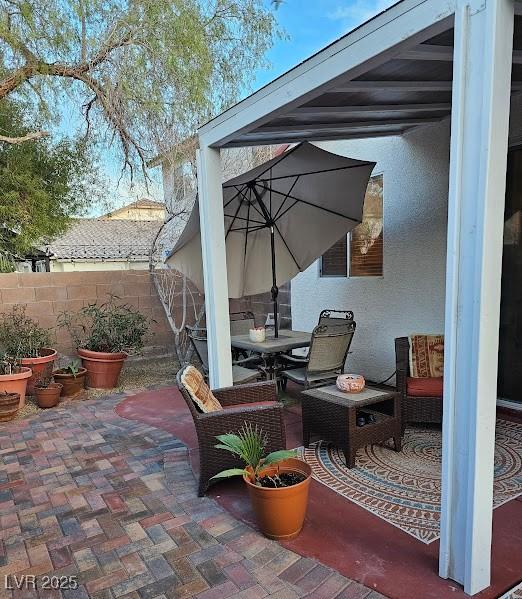 view of patio / terrace featuring outdoor dining space and fence