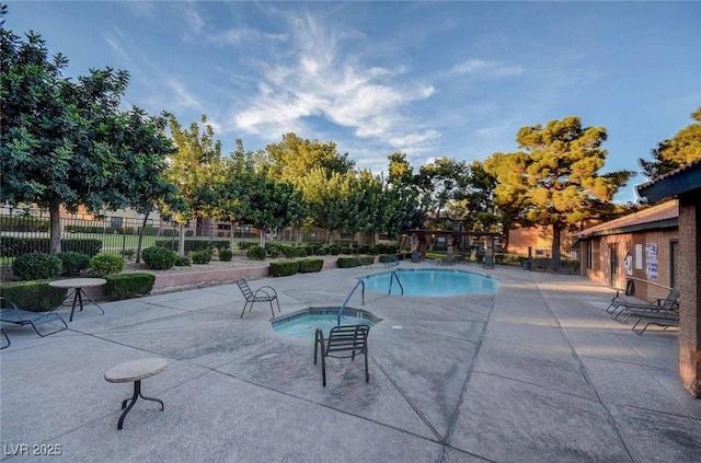 2451 N Rainbow Blvd Unit 2076, Las Vegas, NV 89108 - community pool featuring a hot tub and a patio