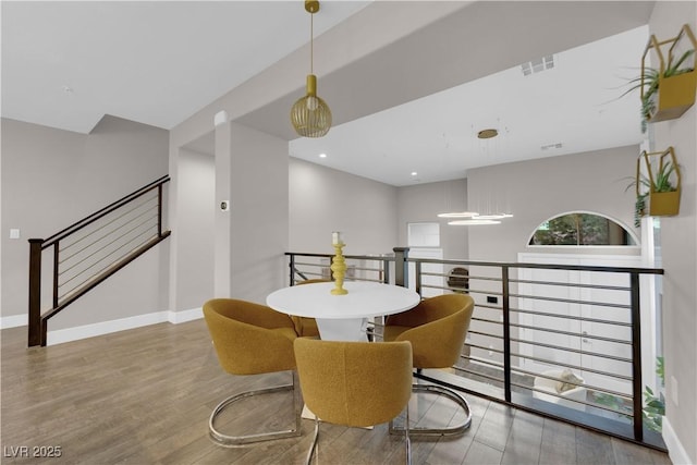 dining area featuring recessed lighting, visible vents, baseboards, and wood finished floors