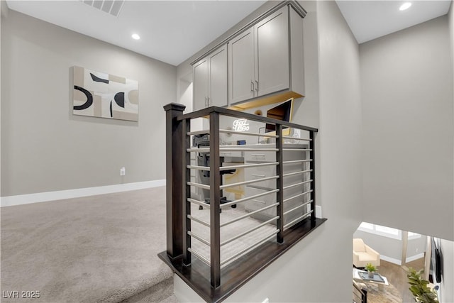 stairway featuring carpet floors, recessed lighting, visible vents, and baseboards