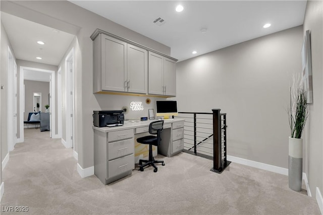 office space featuring light colored carpet, visible vents, baseboards, and recessed lighting