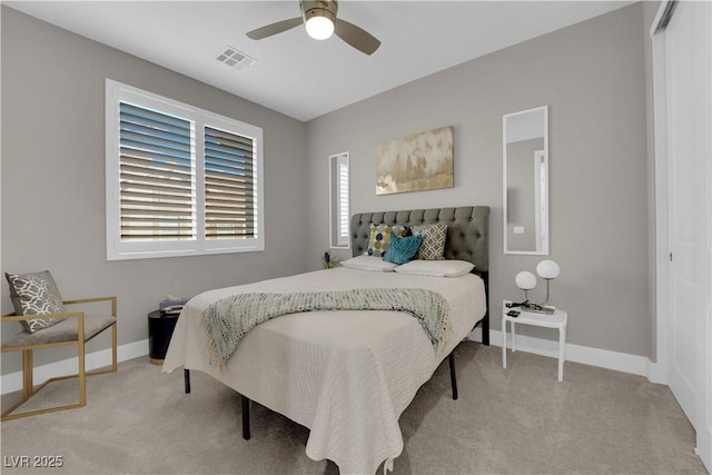 bedroom featuring light carpet, baseboards, visible vents, and ceiling fan