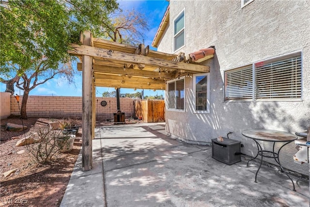 view of patio featuring a fenced backyard and a pergola