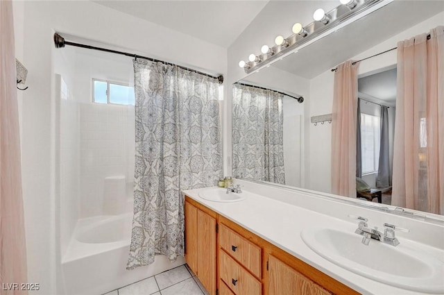 full bath with double vanity, shower / bathtub combination with curtain, a sink, and tile patterned floors