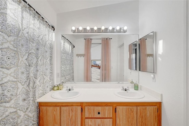 bathroom featuring double vanity and a sink