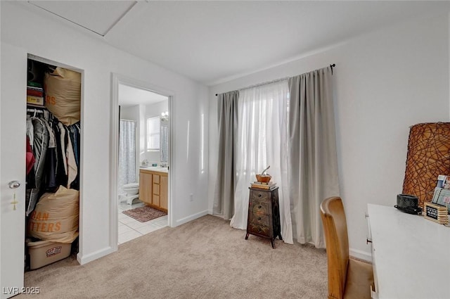 home office featuring light colored carpet and baseboards