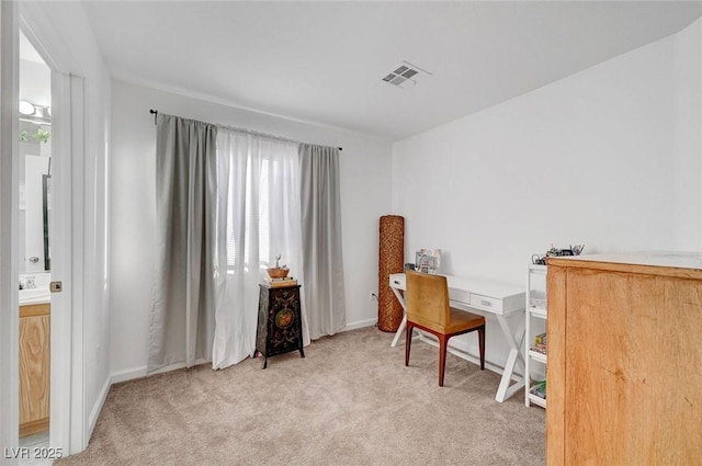 office space featuring light carpet and visible vents