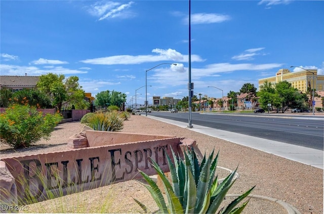 view of street featuring sidewalks and street lights