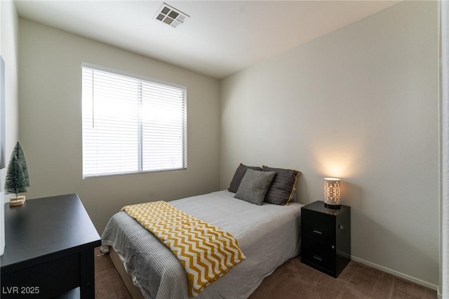 bedroom with carpet, visible vents, and baseboards