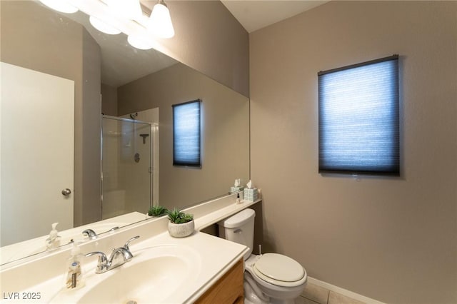 full bath featuring a stall shower, baseboards, toilet, tile patterned flooring, and vanity