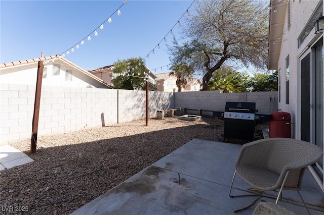 view of patio / terrace featuring area for grilling and a fenced backyard