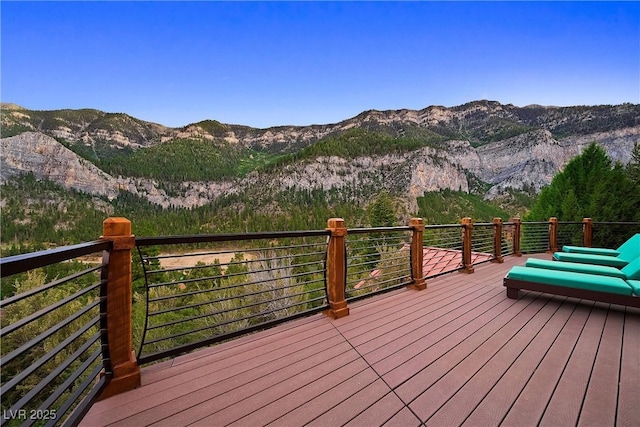 wooden deck with a mountain view