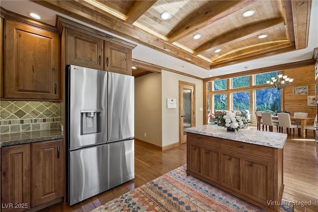 kitchen with wooden ceiling, stainless steel refrigerator with ice dispenser, backsplash, beam ceiling, and dark wood-style floors