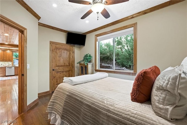 bedroom with ornamental molding, dark wood-type flooring, a ceiling fan, a textured ceiling, and baseboards