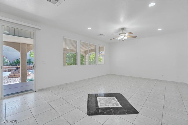 spare room featuring recessed lighting, visible vents, ceiling fan, and light tile patterned floors