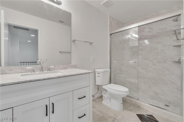 full bath with toilet, vanity, and visible vents