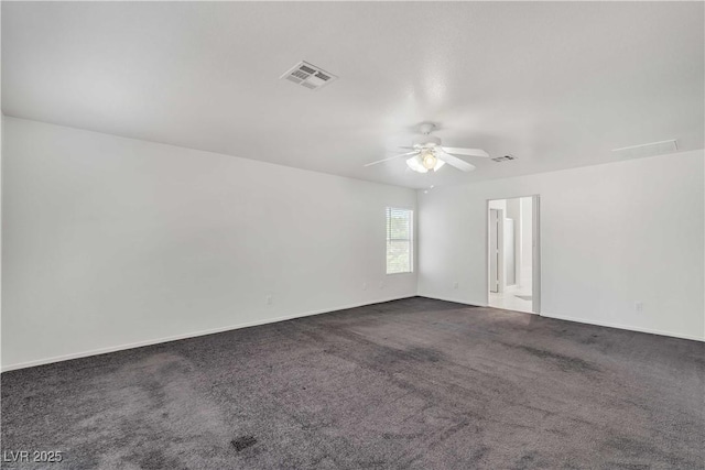 empty room featuring baseboards, carpet, visible vents, and a ceiling fan