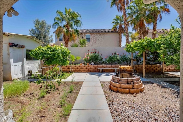 view of yard featuring fence and a patio