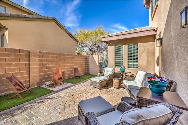 view of patio featuring fence