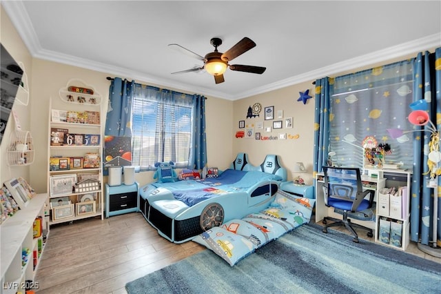 bedroom with wood finished floors, a ceiling fan, and crown molding