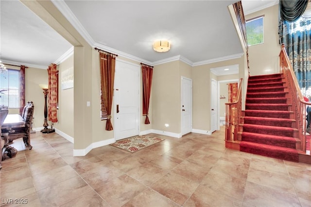 entryway featuring baseboards, stairway, and crown molding