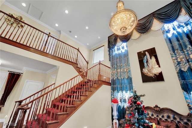 stairway with recessed lighting, a notable chandelier, crown molding, and a towering ceiling