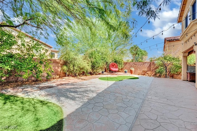 view of patio with a fenced backyard