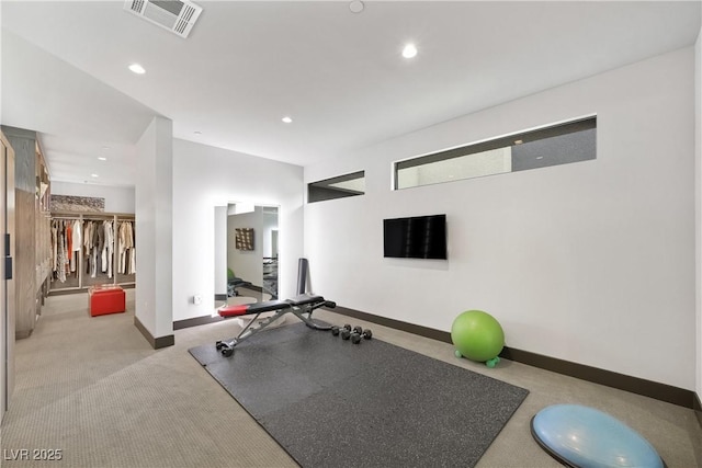 exercise room with recessed lighting, visible vents, and baseboards