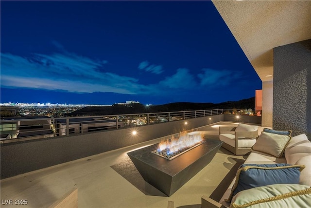 view of patio / terrace with a fire pit