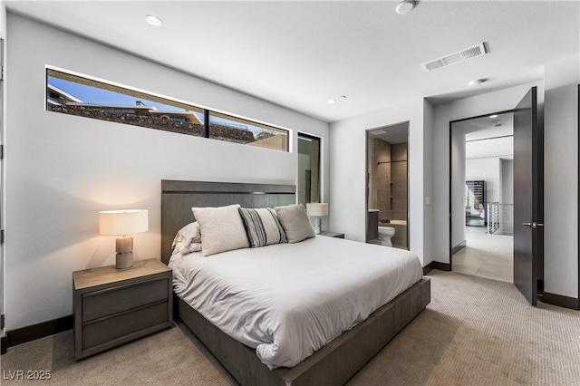 bedroom with baseboards, visible vents, light colored carpet, ensuite bath, and recessed lighting