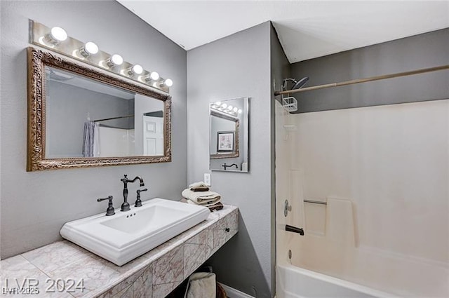 478 Potomac St, Henderson, NV 89015 - bathroom with shower / bathtub combination with curtain and a sink