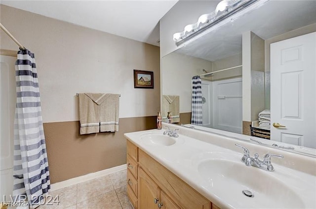 478 Potomac St, Henderson, NV 89015 - bathroom featuring a shower with curtain, double vanity, a sink, and tile patterned floors
