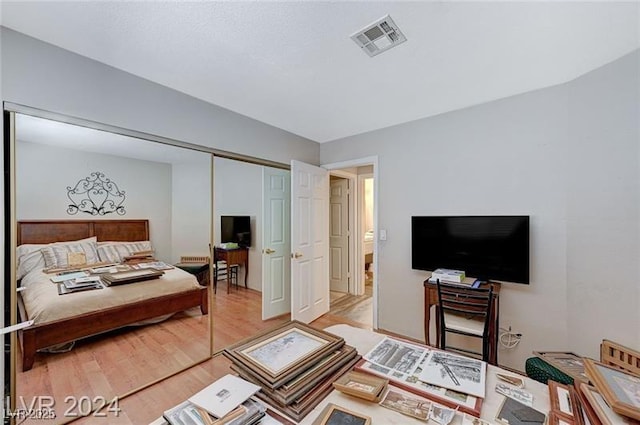 478 Potomac St, Henderson, NV 89015 - bedroom with light wood-type flooring, visible vents, and a closet