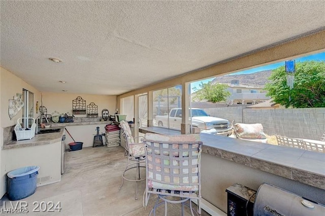 478 Potomac St, Henderson, NV 89015 - view of patio featuring fence, an outdoor kitchen, a sink, and outdoor wet bar
