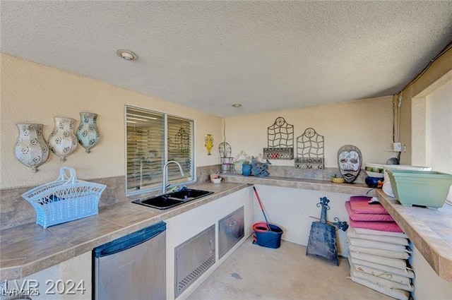 478 Potomac St, Henderson, NV 89015 - kitchen with tile counters, a sink, a textured ceiling, and dishwasher