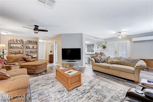 478 Potomac St, Henderson, NV 89015 - living room featuring ceiling fan, visible vents, wood finished floors, and a wall mounted AC