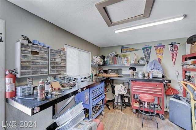478 Potomac St, Henderson, NV 89015 - office space featuring attic access, a textured ceiling, wood finished floors, and a workshop area